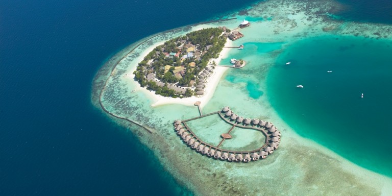 Bird view of the water villas - In harmony with the lagoon of the island you can see the luxury water villas.